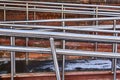 Shiny handrails of a modern ramp for the disabled attached to the old building