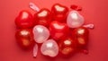 Shiny Heart-Shaped Balloons on Red Background Royalty Free Stock Photo