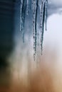Shiny icicles hanging from a winter in Sunny winter day Royalty Free Stock Photo