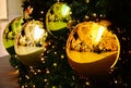 Decorative gold and greeen glass christmas ornament balls on pine tree Royalty Free Stock Photo