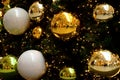 Decorative gold and greeen glass christmas ornament balls on pine tree Royalty Free Stock Photo