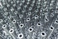 Shiny long steel parts full frame background, clean steel rods after fine cnc turning. Royalty Free Stock Photo