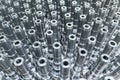 Shiny long steel parts full frame background, clean steel rods after fine cnc turning. Royalty Free Stock Photo