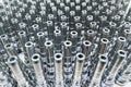 Shiny long steel parts full frame background, clean steel rods after fine cnc turning standing vertically. Royalty Free Stock Photo