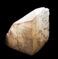 Shiny luminous transparent calcite mineral crystal from Alchak, Crimea. A backlight photo of a stone isolated on black