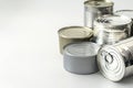 Shiny Metal Cans on White Background With Copy Space Concept for Old-fashioned Food Storage, Sustainable Recyclable Packaging, and