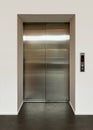 Shiny metal doors of a modern passenger elevator Royalty Free Stock Photo