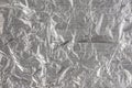 Shiny metal silver gray foil crumpled texture background