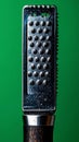 Shiny Metal Zester CloseUp on Green Background Royalty Free Stock Photo