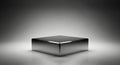 Shiny metallic cube centered on a stage with dramatic spotlight lighting Royalty Free Stock Photo