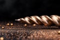 Shiny metallic drill bit on glittering surface Royalty Free Stock Photo