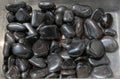 metallic gray tumbled hematite gemstone as mineral rock