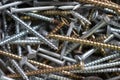 A jumble of nails and screws. Construction hardware background