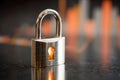 Shiny metallic padlock on reflective surface with glowing keyhole symbolizing digital security and data protection concepts in Royalty Free Stock Photo