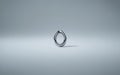 Sleek modern metal ring with smooth loop design on light background Royalty Free Stock Photo
