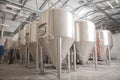 Shiny microbrewery beer tanks at beer factory Royalty Free Stock Photo