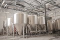 Shiny microbrewery beer tanks at beer factory Royalty Free Stock Photo