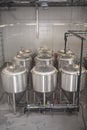 Shiny microbrewery beer tanks at beer factory Royalty Free Stock Photo
