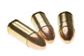 Shiny 9 mm caliber Bullets. Close-up of a 9mm full metal jacket ammo isolated on white background