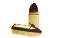 Shiny 9 mm caliber Bullets. Close-up of a 9mm full metal jacket ammo isolated on white background