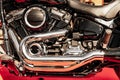 Shiny chrome motorcycle engine parts on red close up Royalty Free Stock Photo