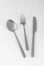 Shiny new cutlery, silverware close-up on white background Royalty Free Stock Photo