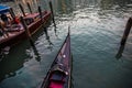 The shiny nose trim of a traditional Venetian gondola aka Ferro on calm water, Venice, Italy