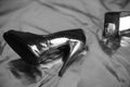 Shiny patent leather womens shoes in a retro classic style lie on a vinyl surface