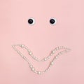 Shiny pearl smile on pink background Royalty Free Stock Photo