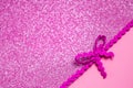 Shiny, pink, blurred holiday background. Luminous bokeh magic. Patterned braid. Space for text Royalty Free Stock Photo