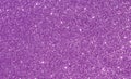 Shiny pink or purple glitter background with light reflections
