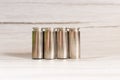 Shiny pistol ammunition on a wooden, gray table. Close up macro