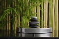 shiny podium with spa stones, bamboo backdrop gently out of focus Royalty Free Stock Photo