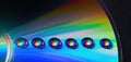 Shiny raibow colored water drops on the old compact CD disc, design for background Royalty Free Stock Photo