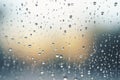 Shiny raindrops splashes falling cascading down wet glossy foggy glass window car outdoor during rainy stormy day Royalty Free Stock Photo