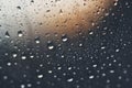 Shiny raindrops splashes falling cascading down wet glossy foggy glass window car outdoor during rainy stormy day Royalty Free Stock Photo