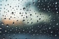 Shiny raindrops splashes falling cascading down wet glossy foggy glass window car outdoor during rainy stormy day Royalty Free Stock Photo