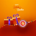 Shiny rakhi with gift boxes on orange and red background.