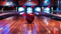A shiny red bowling ball rolls confidently down the lane, building excitement Royalty Free Stock Photo