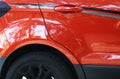 Shiny red car with reflection of the park background Royalty Free Stock Photo