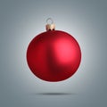 Shiny red Christmas ball in air on grey background Royalty Free Stock Photo