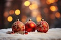 shiny red Christmas ball bouncing in front of blurred Christmas candle light and unfocused bokeh Royalty Free Stock Photo