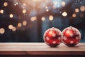 shiny red Christmas ball bouncing in front of blurred Christmas candle light and unfocused bokeh Royalty Free Stock Photo