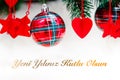 Shiny red christmas balls, heart and stars on white with pine tree with text. Yeni yiliniz kutlu olsun means happy new year Royalty Free Stock Photo