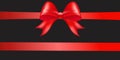 Shiny red color satin ribbon on black background