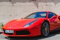 Shiny red Ferrari parked on street sports car Royalty Free Stock Photo