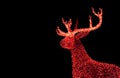 Shiny Red Illuminated Christmas Reindeer Shaped Outdoor Decoration Lights on Dark Background Royalty Free Stock Photo