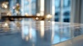 Shiny reflective surface of a polished marble table capturing blurred cityscape reflections with soft natural light in a modern Royalty Free Stock Photo