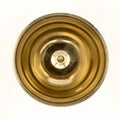 a shiny round brass oil lamp