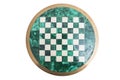 Shiny round green stone empty chess board on isolated background.